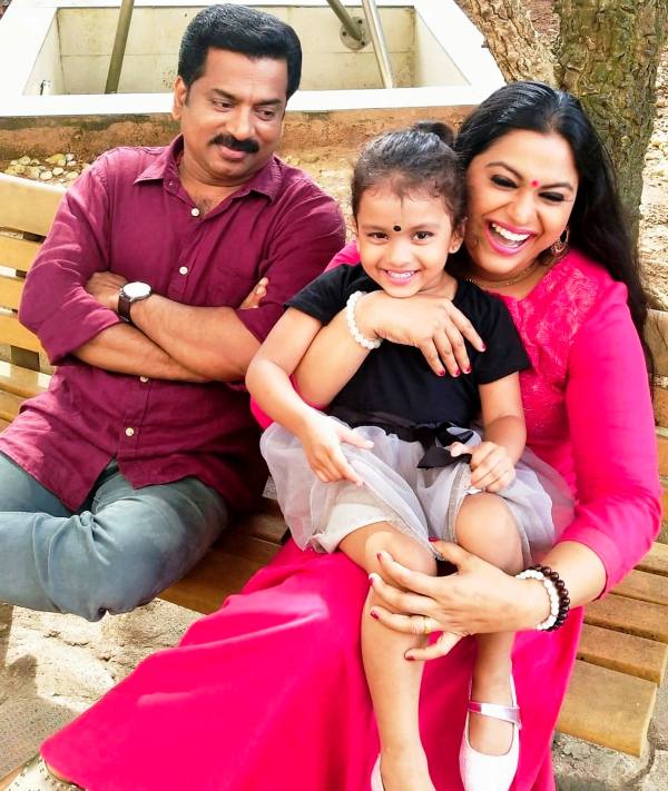 Lakshmi Priya with her husband and daughter