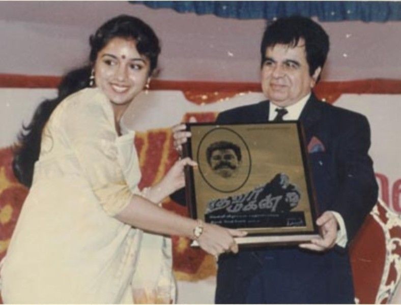 Revathi receiving award from Dilip Kumar