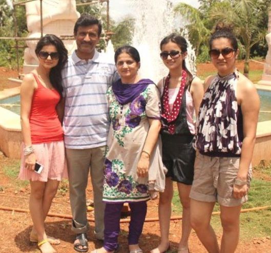 Rubina Dilaik (red top) with her parents and two sisters