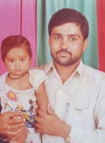 A childhood picture of Divya Kakran with her father