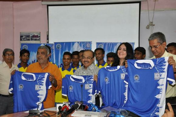 Agnimitra Paul presenting thematic jersey for the Kolkata XI with KMC officials