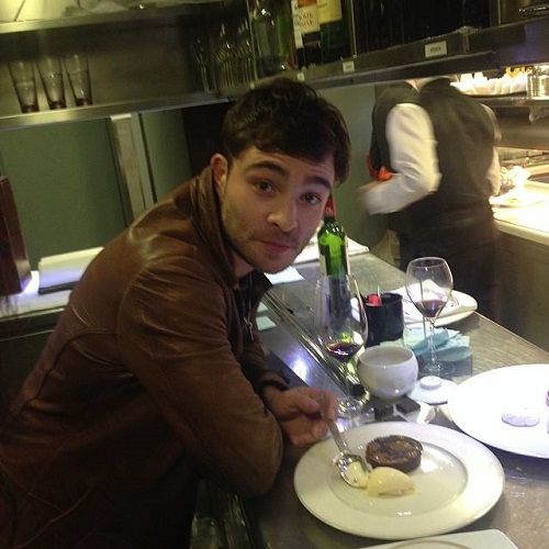 Ed Westwick with a glass of red wine