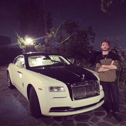 Ed Westwick with his white Rolls-Royce car