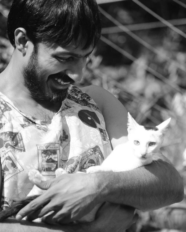 Harish Uthaman with his pet cat, Poocha