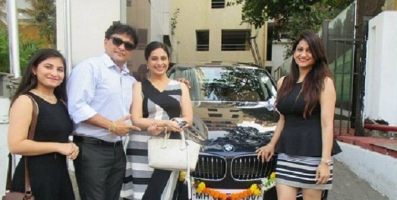 Kishori Godbole with her brand new BMW car
