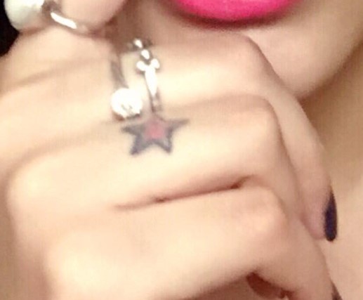 Kyra Dutt featuring a tattoo on her finger