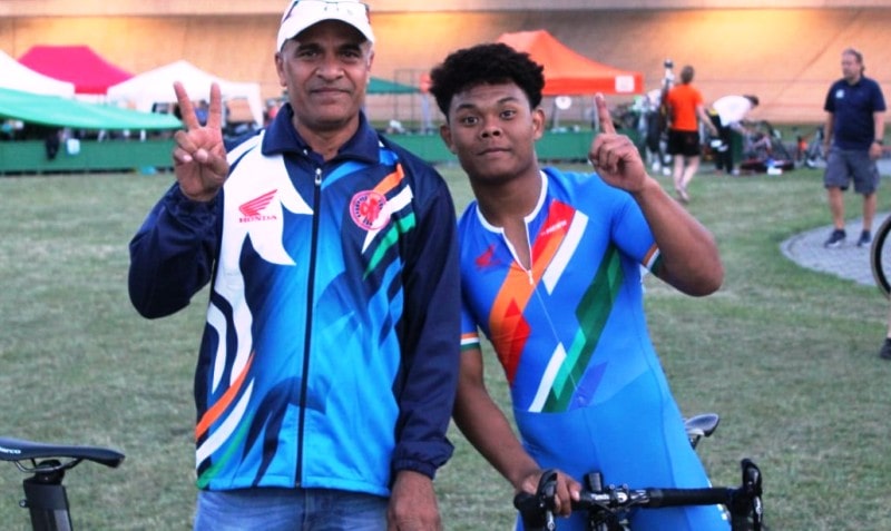 RK Sharma with an Indian cyclist during an international competition