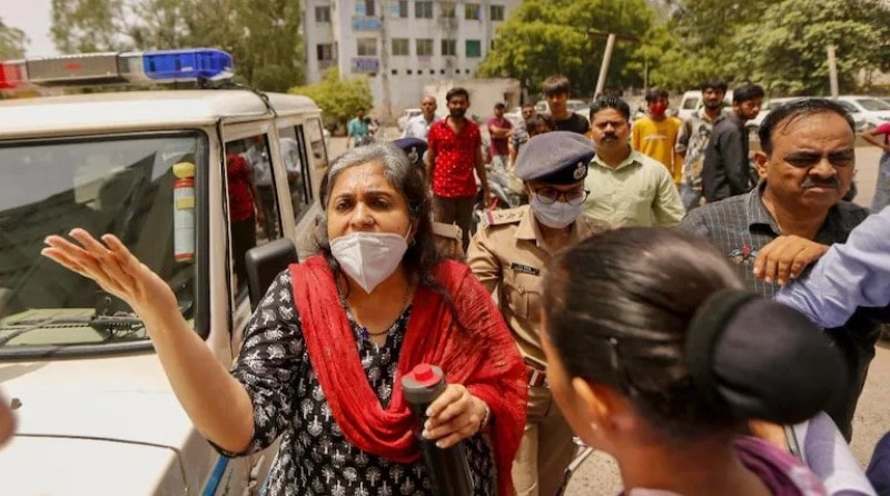 Teesta Setalvad being taken to a police station in Mumbai