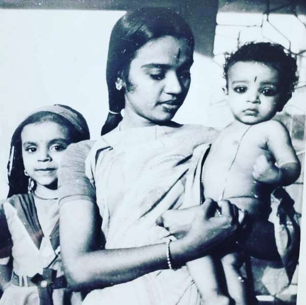A childhood photo of Blaaze with his mother and sister