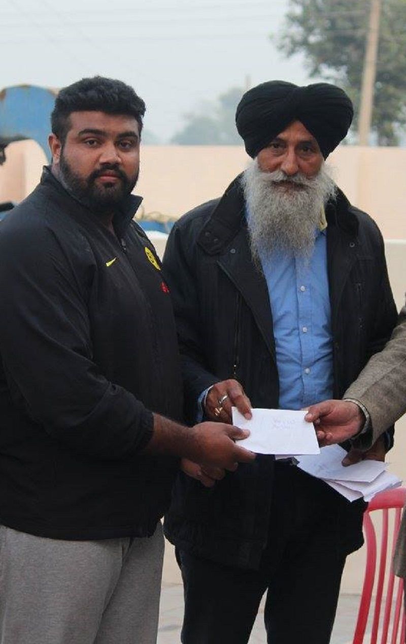 An old image of Tajinderpal Singh Toor with his coach