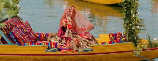 Anila Kharbanda sitting in a shikara boat on her wedding day