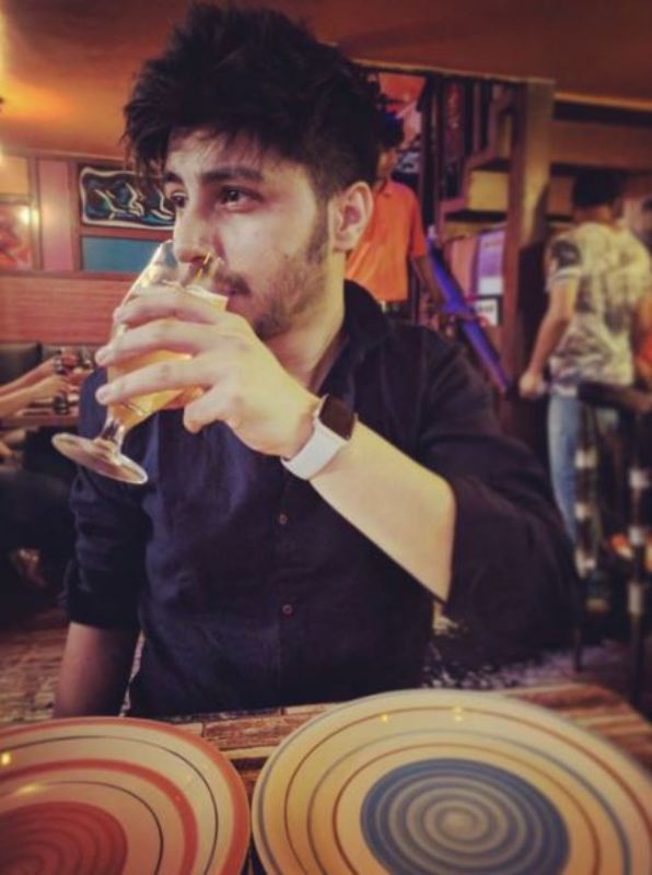Arjun Harjai drinking beer
