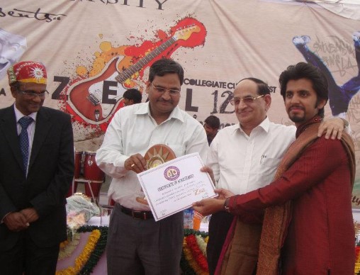 Cheitan Sharma while receiving a scholarship award