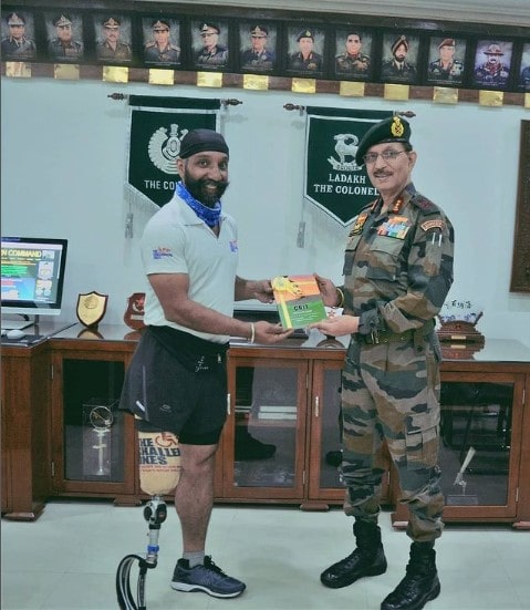DP Singh presenting a copy of his book to Northern Indian Army Commander Lt Gen YK Joshi