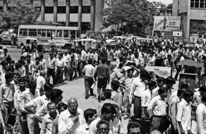 File photo of stock market investors in a long queue in front of bank counters with share applications and deposits at Parliament street in New Delhi on May 08, 1992