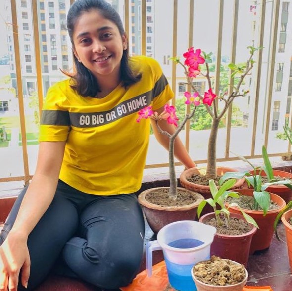 Mehuli Ghosh while planting saplings at her home