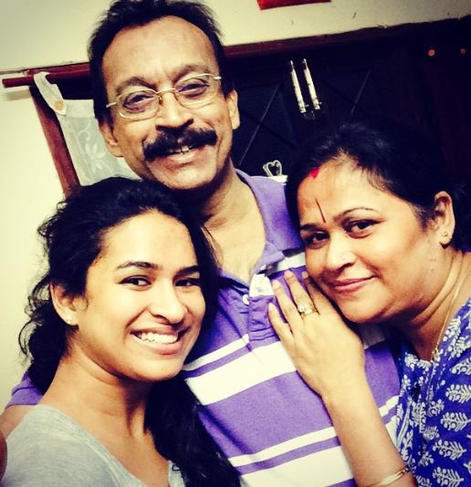 Misha Ghoshal with her parents