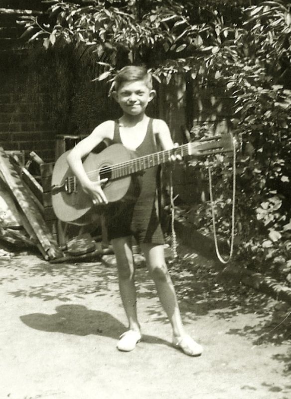 Monty Norman with his guitar when he was young