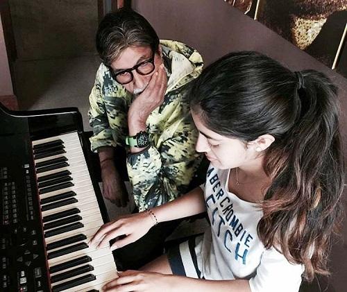 Navya Naveli Nanda while playing the piano as Amitabh Bachchan looks at her