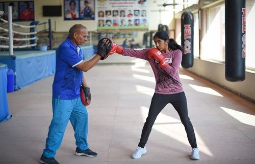 Nitu Ghanghas with her coach Jagdish Singh