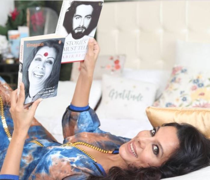 Pooja Bedi holding her mother's autobiography, Timepass- The Memoirs of Protima Bedi