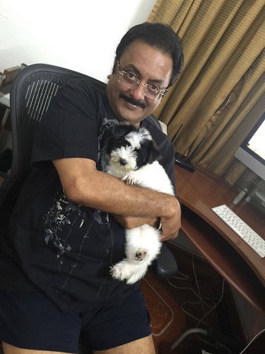 Pratap Pothen with his pet dog