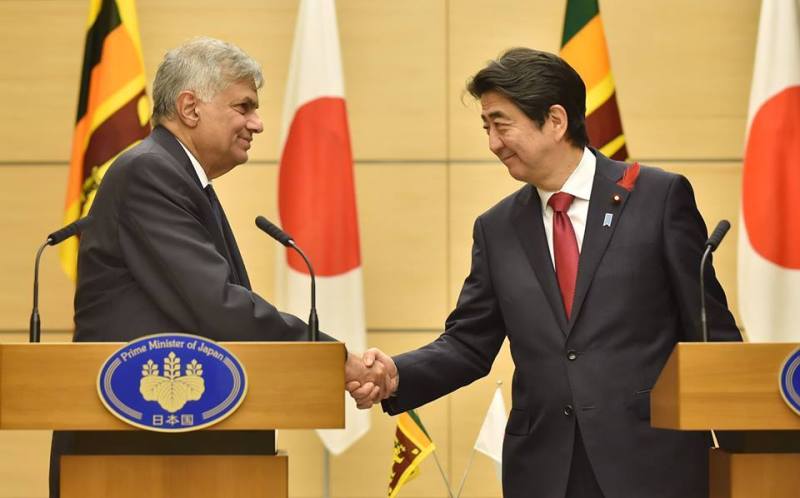Ranil Wickremesinghe shaking hands with the former PM of Japan Shinzo Abe, who was assassinated in 2022