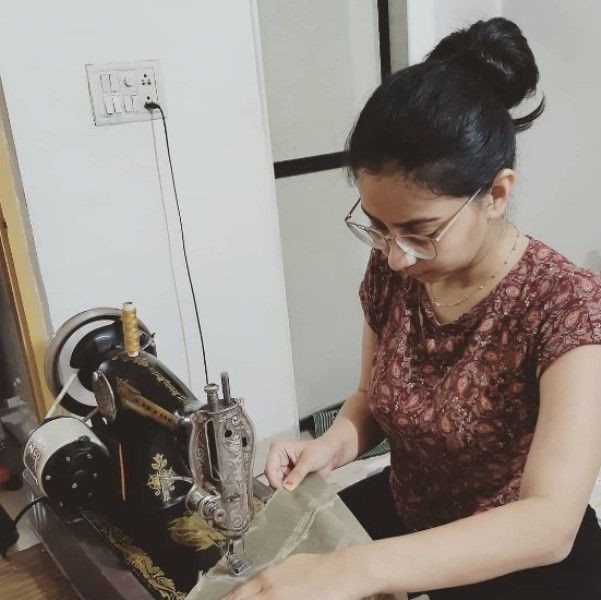 Rupal Nand sewing clothes