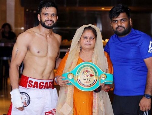 Sagar Narwat with his mother and brother