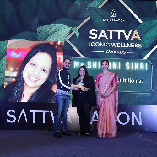 Shivani Sikri receiving an award