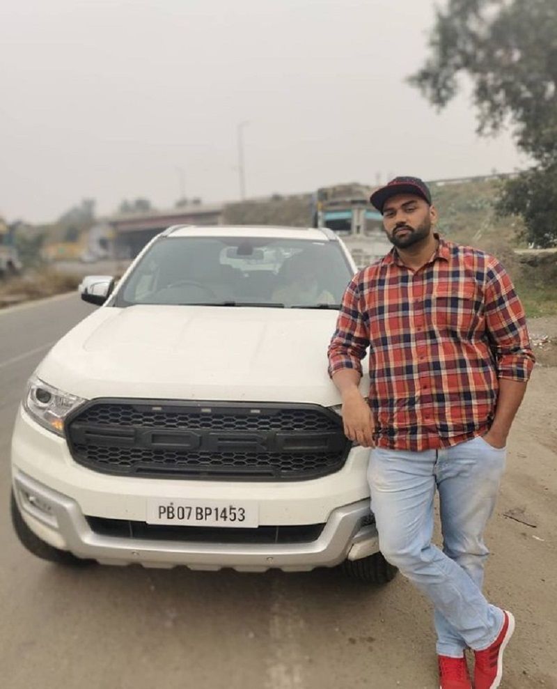 Tajinderpal Singh Toor posing with his Endeavour car