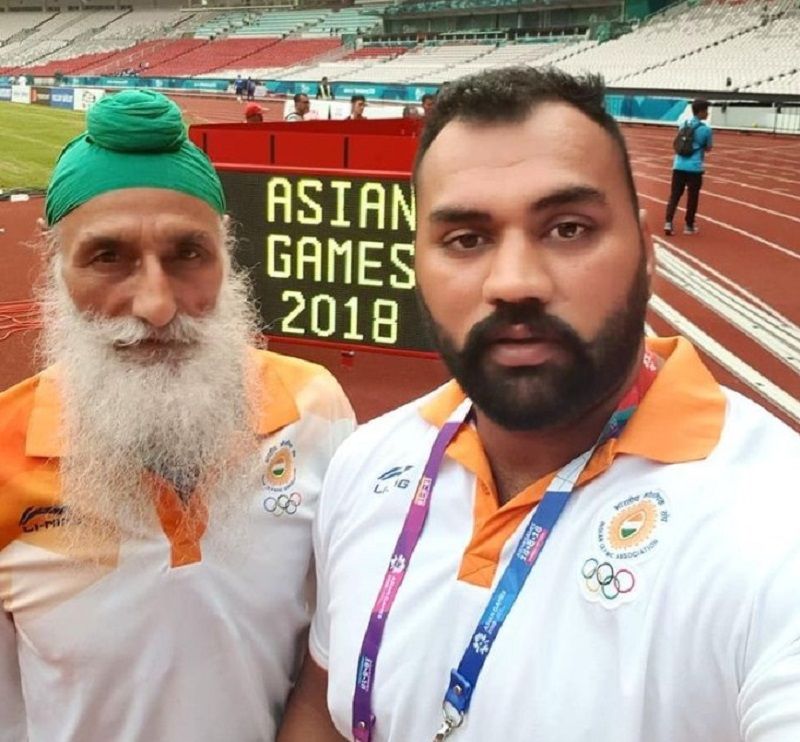 Tajinderpal Singh Toor with his coach during the Asian Games 2018