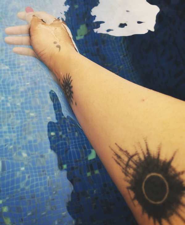 Aaryaa's sun and eclipse tattoos