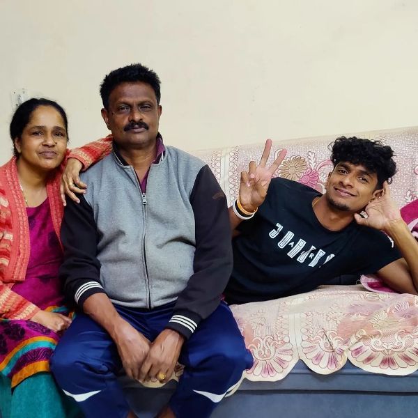 Amoj Jacob with his parents