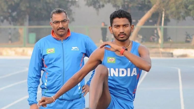 Avinash Sable with his coach, Amrish Kumar