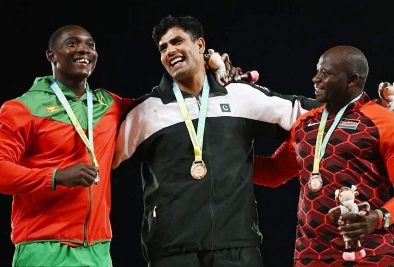 Gold medallist Arshad Nadeem of Pakistan (centre), silver medallist Anderson Peters of Grenada (left), and bronze medallist Julius Yego of Kenya at the 2022 Commonwealth Games (Birmingham)