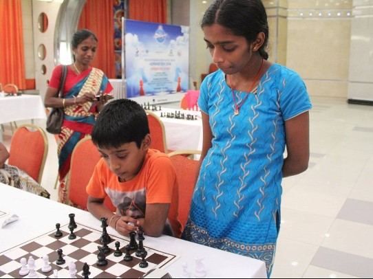 R Vaishali and her younger brother while discussing chess doubts