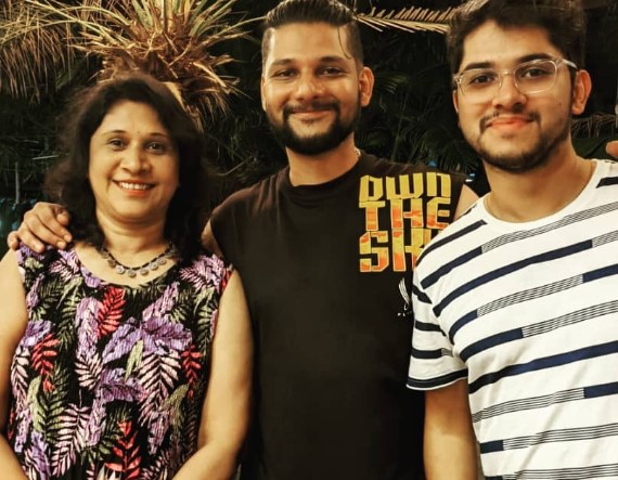 Rakesh Adiga with his mother and brother