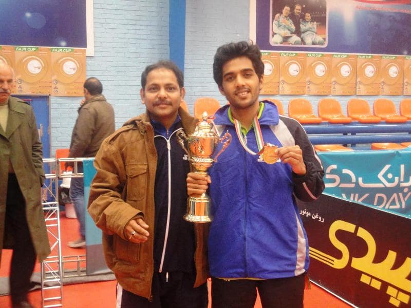 Sanil Shetty with a bronze medal and a trophy during the Fajr Cup