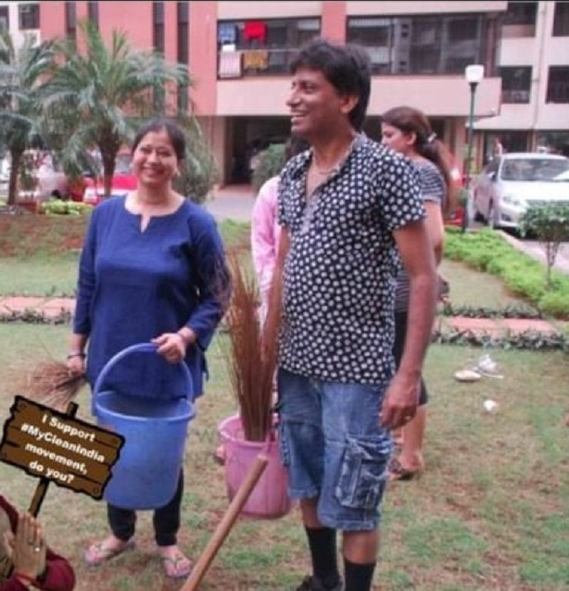 Shikha Srivastava with her husband cleaning the society