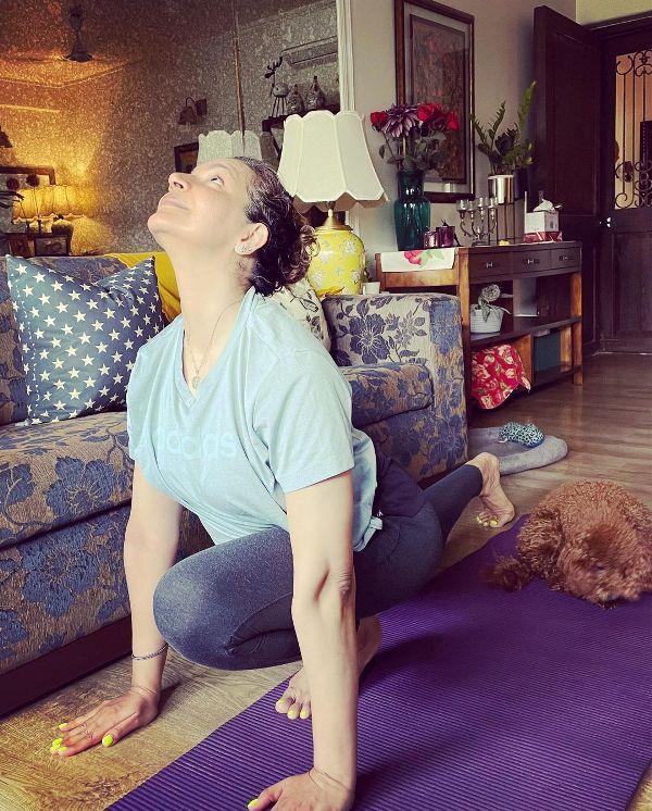 Shweta Kawaatra doing yoga at home accompanied by her dog