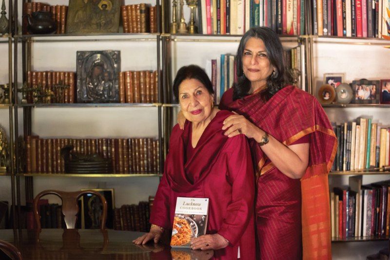Sunita Kohli and her mother, Chand Sur, holding 'The Lucknow Cookbook' in a picture