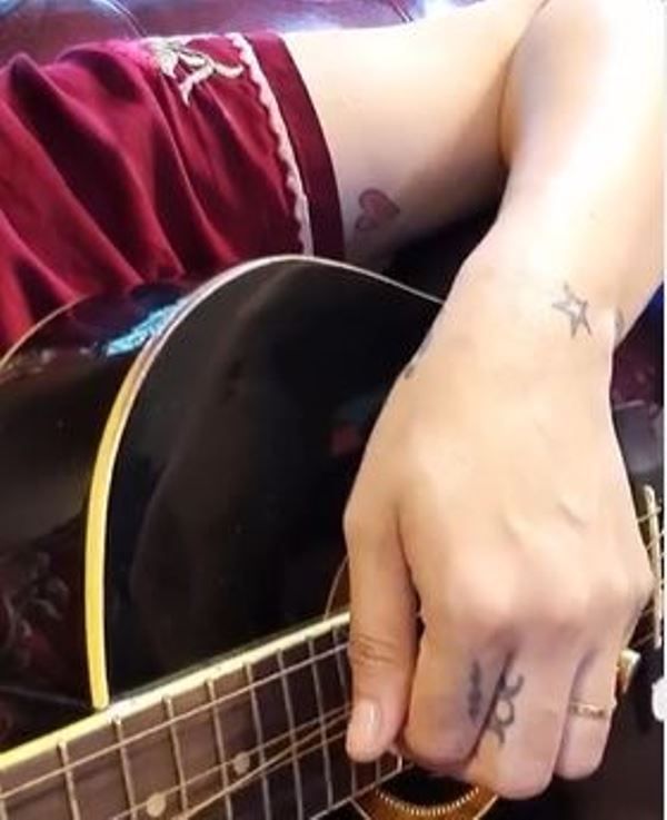 Tattoos on her left hand