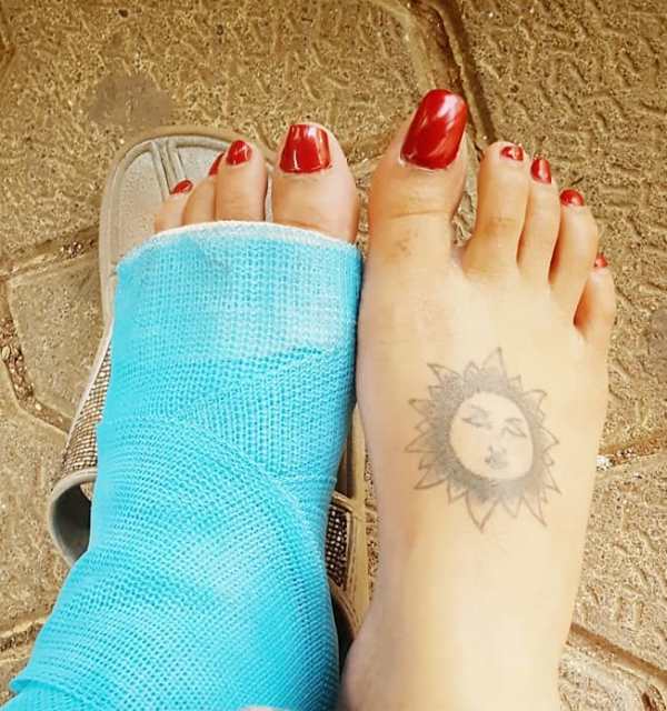 sun tattoo on foot