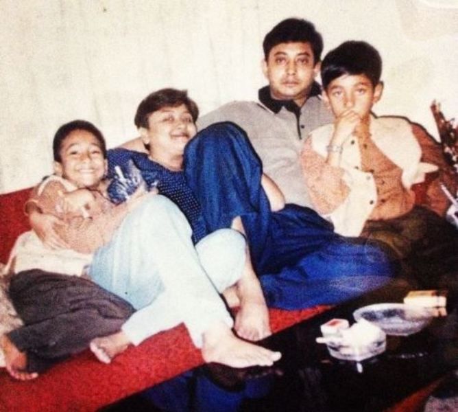 A childhood picture of Utsav Sarkar (left) with his mother, father, and elder brother (right)