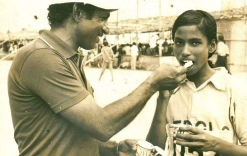 An old picture of P. T. Usha with her coach O. M. Nambiar