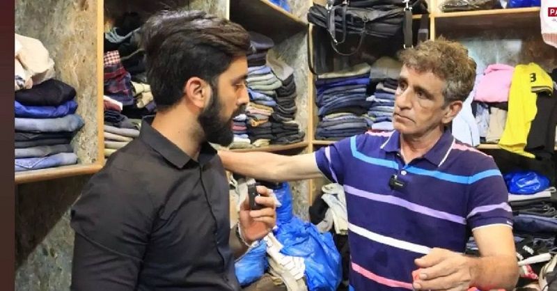 Asad Rauf in his shop selling clothes