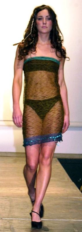 Catherine Middleton walking the ramp during a charity fashion show at the University of St Andrews in 2002 wearing a see-through knitted lace dress