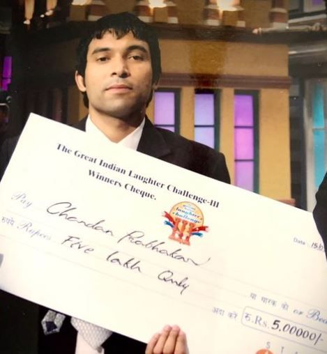 Chandan Prabhakar with his cash prize after being selected as the first runner-up in the comedy show The Great Indian Laughter Challenge