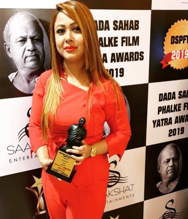 Dada Saheb Phalke Excellence Award winner (2018), Rani Hazarika, holding the trophy
